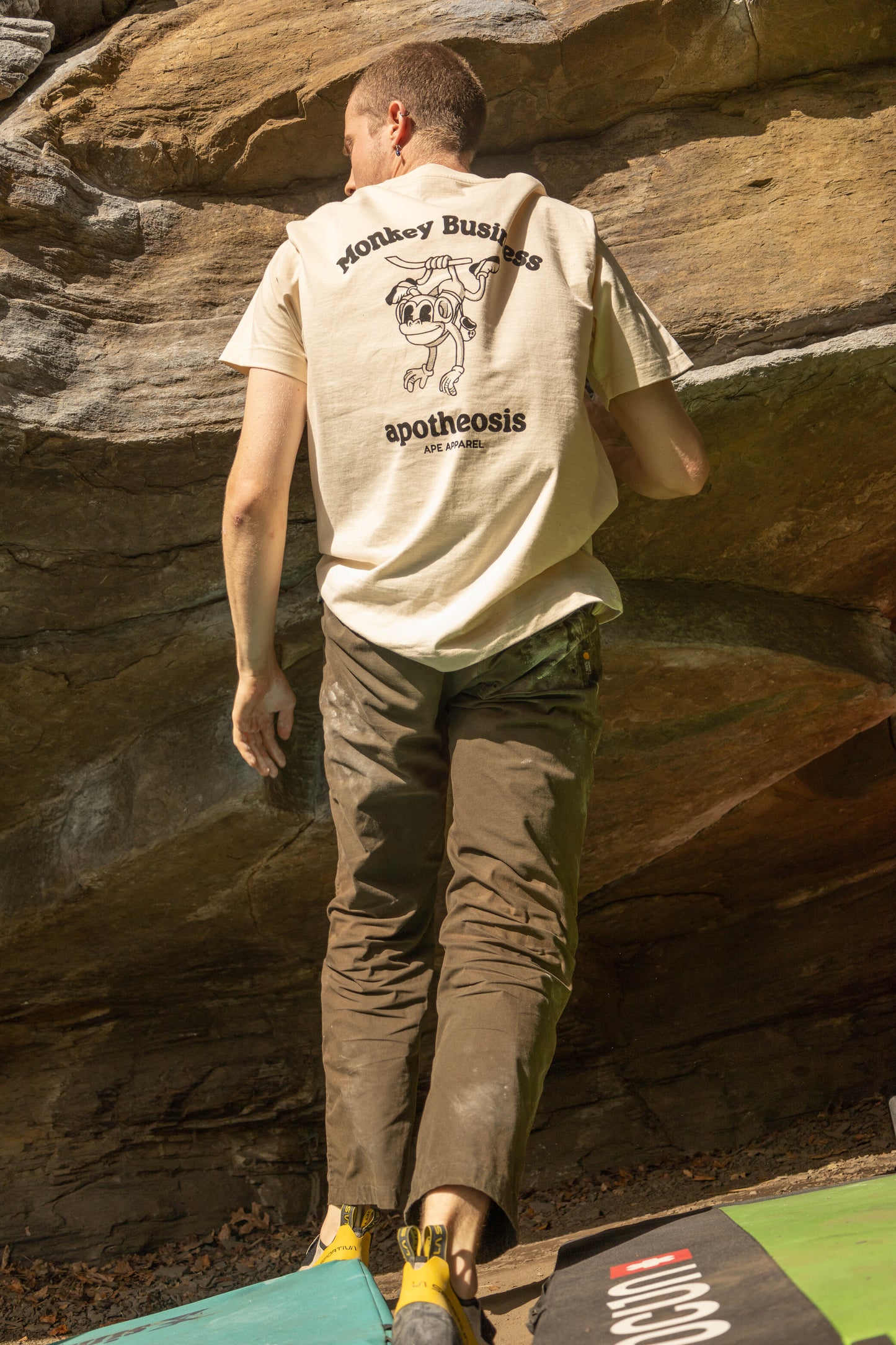 Shot of back of Monkey Business shirt in front of real rock.