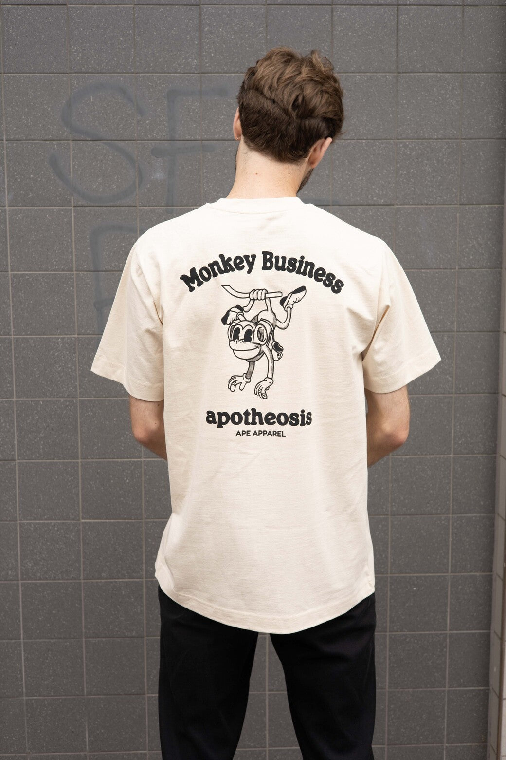 Back of Monkey Business Tee, Model is wearing an L.